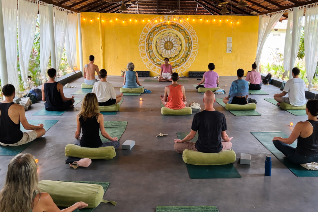 tropical yoga class in serene pavilion